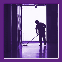silhouette of a man mopping a floor